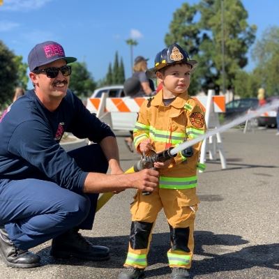 Open House Kid with hose