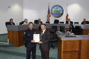 Mayor Vo and Officer of the Year Oscar Valencia